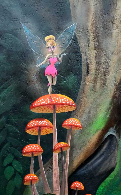 pink fairy on mushroom mural